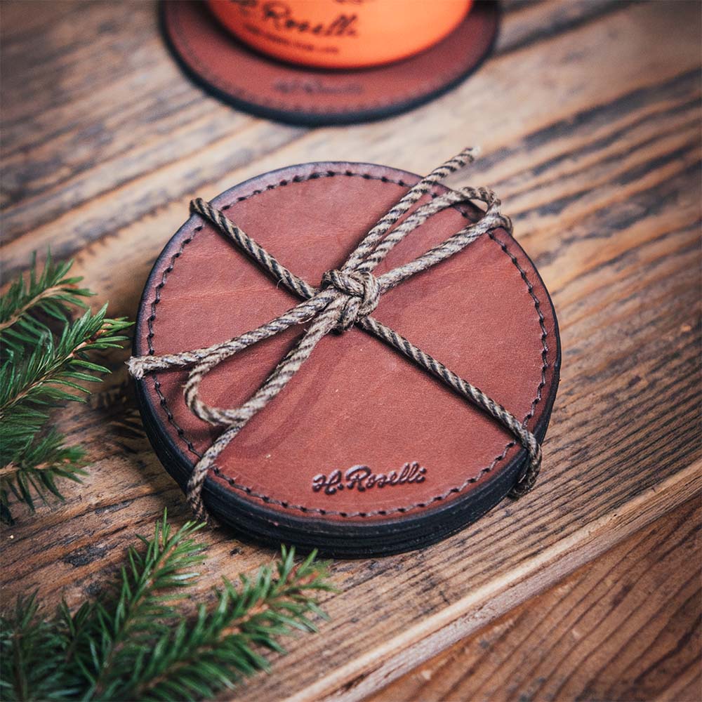 Pack of four handmade Finnish leather coasters. Free engraving included.
