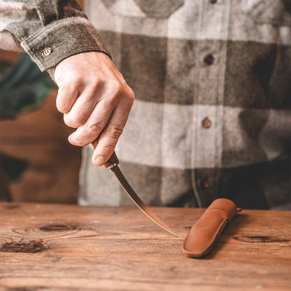 Handmade Finnish Fish and Fillet knife made from ultra high carbon steel and curly birch handle. Comes with a handmade leather sheath. 